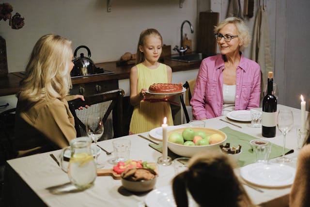 Daughter, mom, and grandmother at dinner table